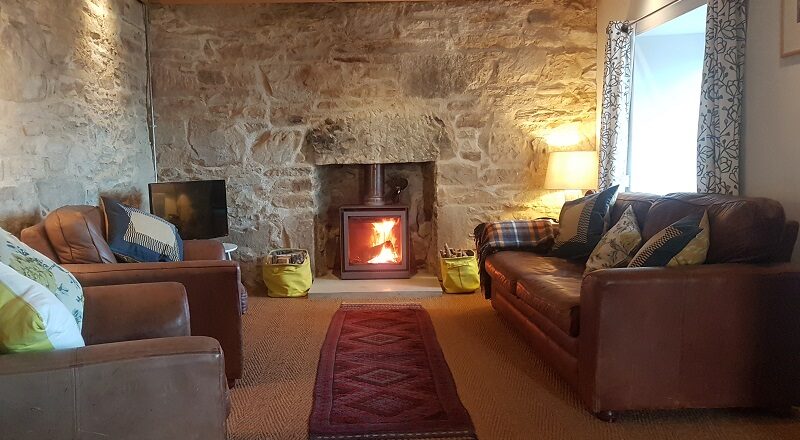 Shot of the lounge to highlight the wood burning stove